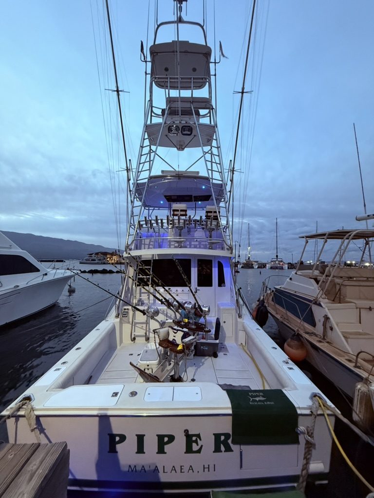 The sportfishing boat Piper in its slip at dawn, Māʻalaea Harbor, Maui
