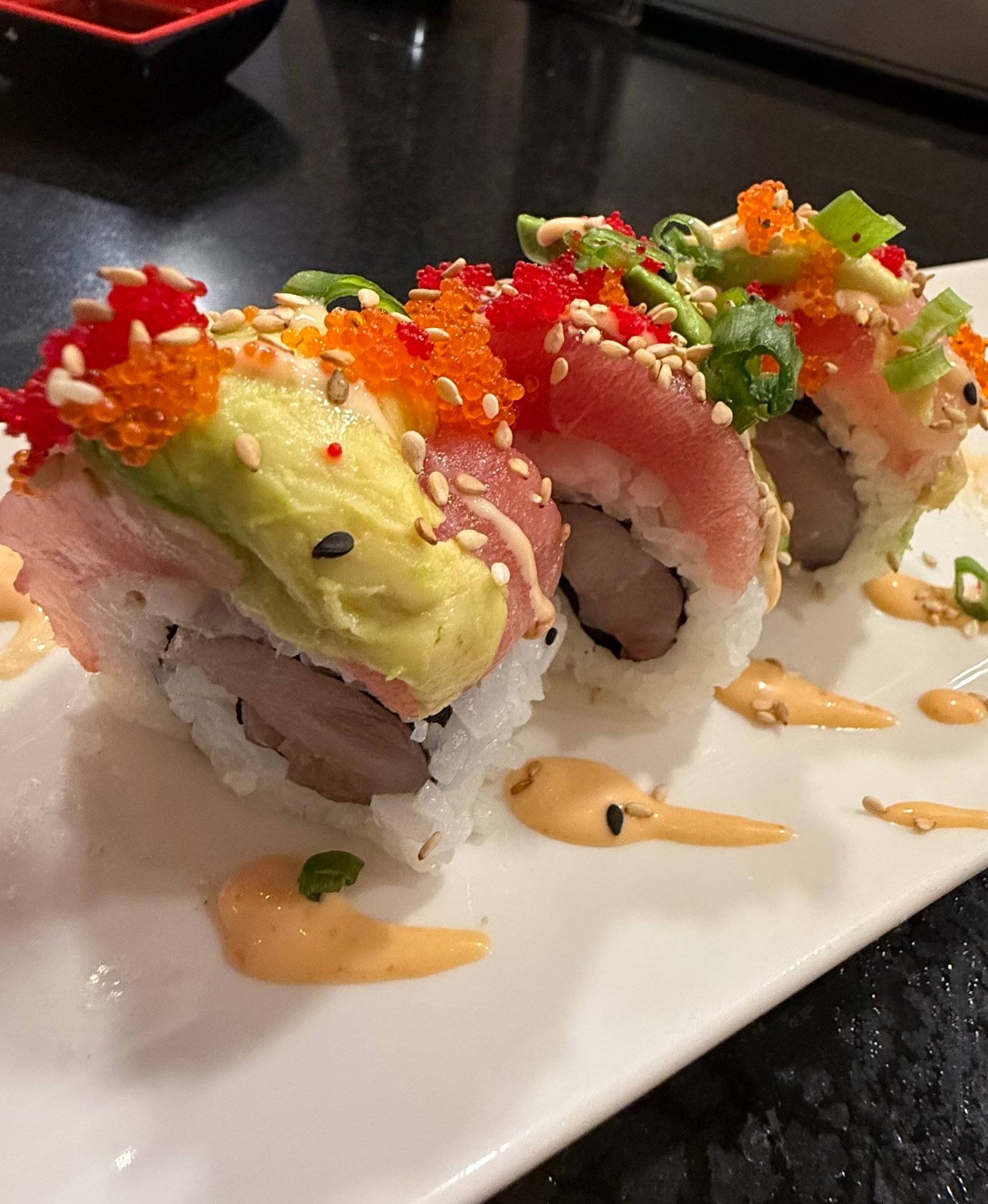 A rainbow roll topped with tuna and tobiko at Miso Phat Sushi