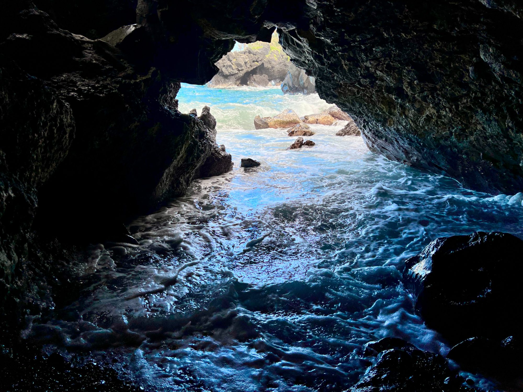 Looking out to the surf from inside a lava sea cave at Waiʻanapanapa