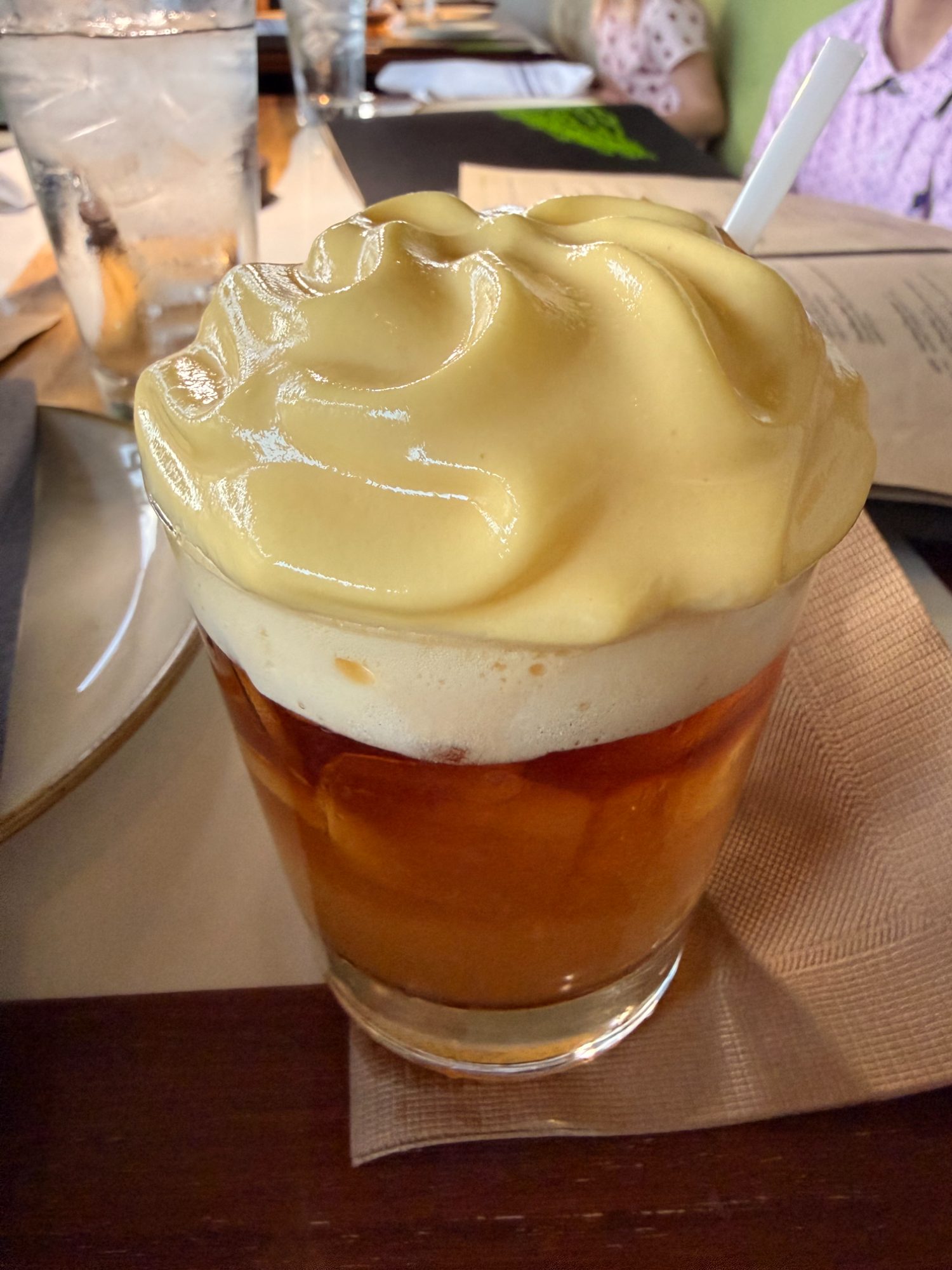 Monkeypod Kitchen's signature mai tai topped with honey-lilikoi foam